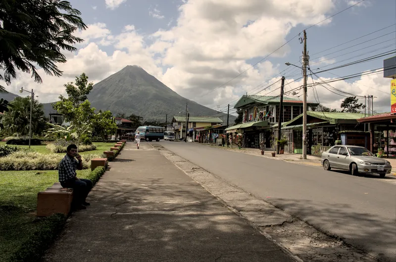 A street in La Fortuna with the volcano
